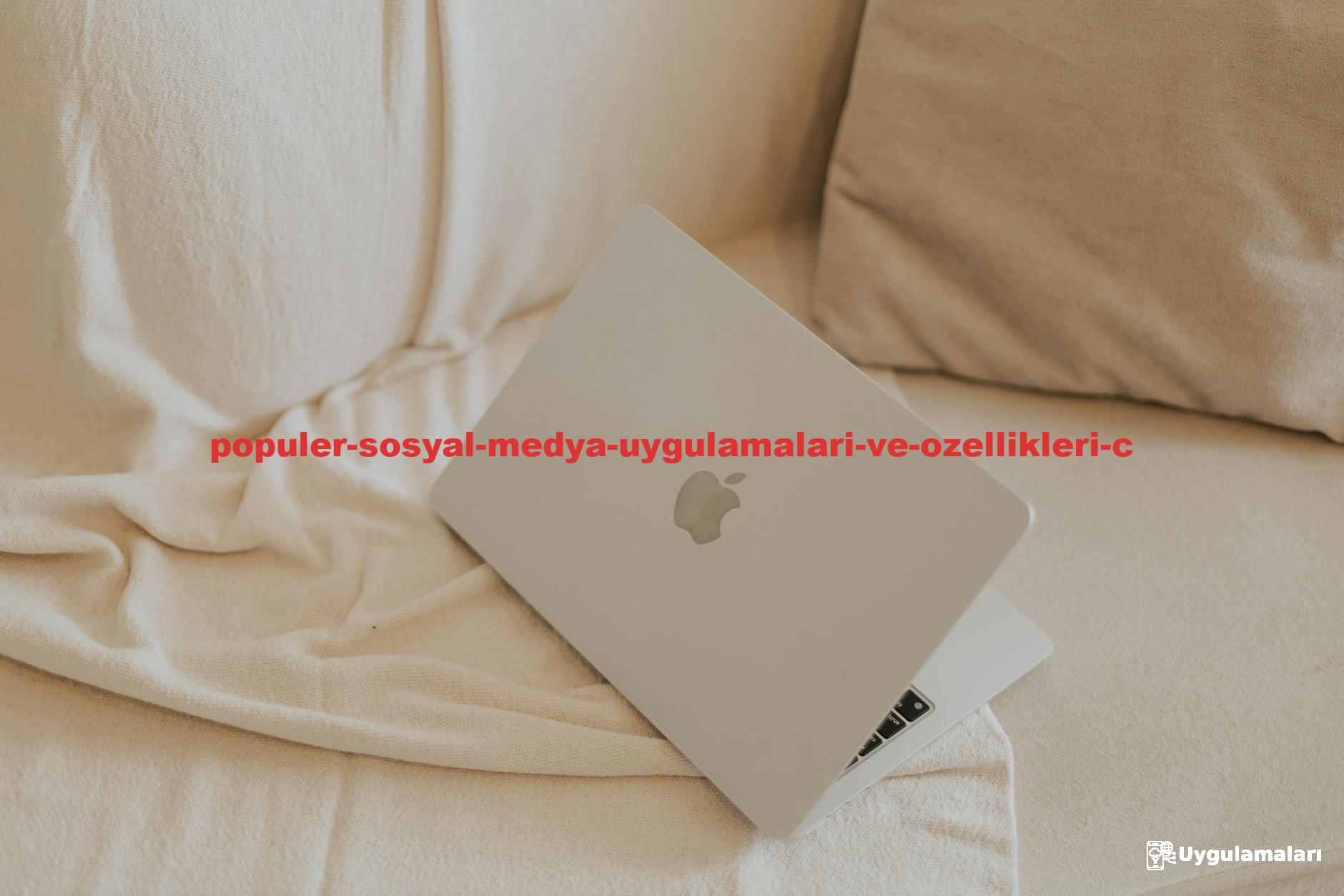 A sleek silver laptop on a beige sofa, perfect for minimalist home office inspiration.