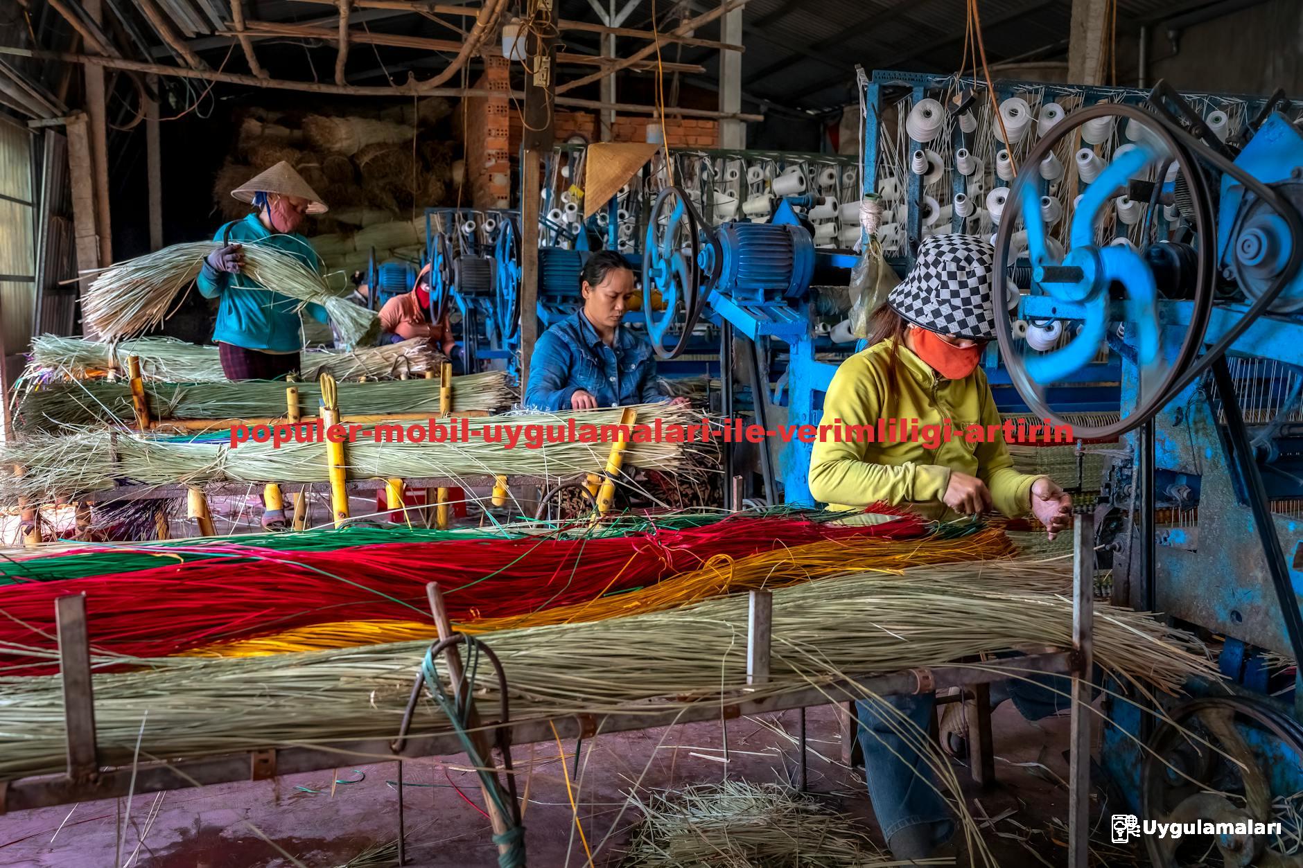 Artisans crafting colorful mats in a vibrant workshop, showcasing traditional weaving techniques.