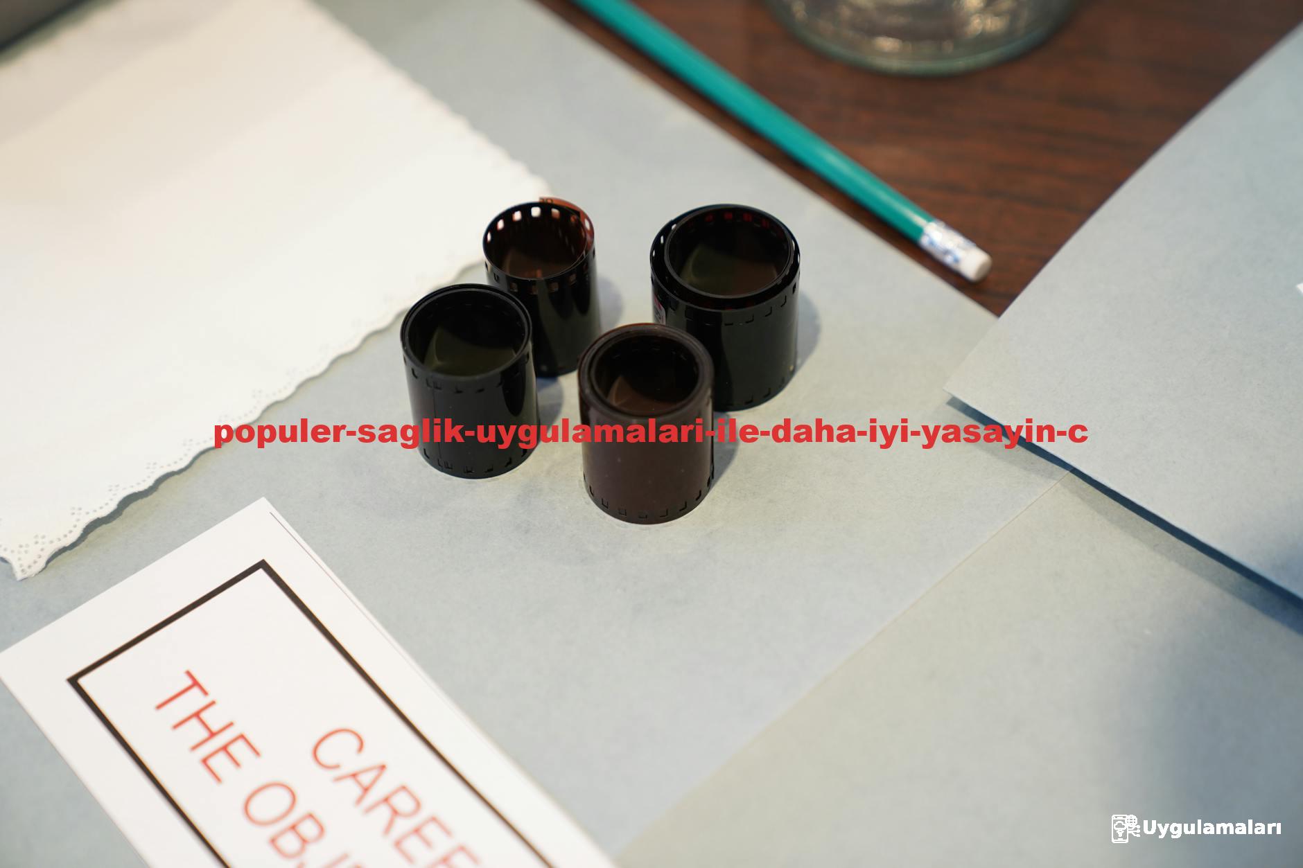 Close-up of film negatives and tools used in vintage photography development.