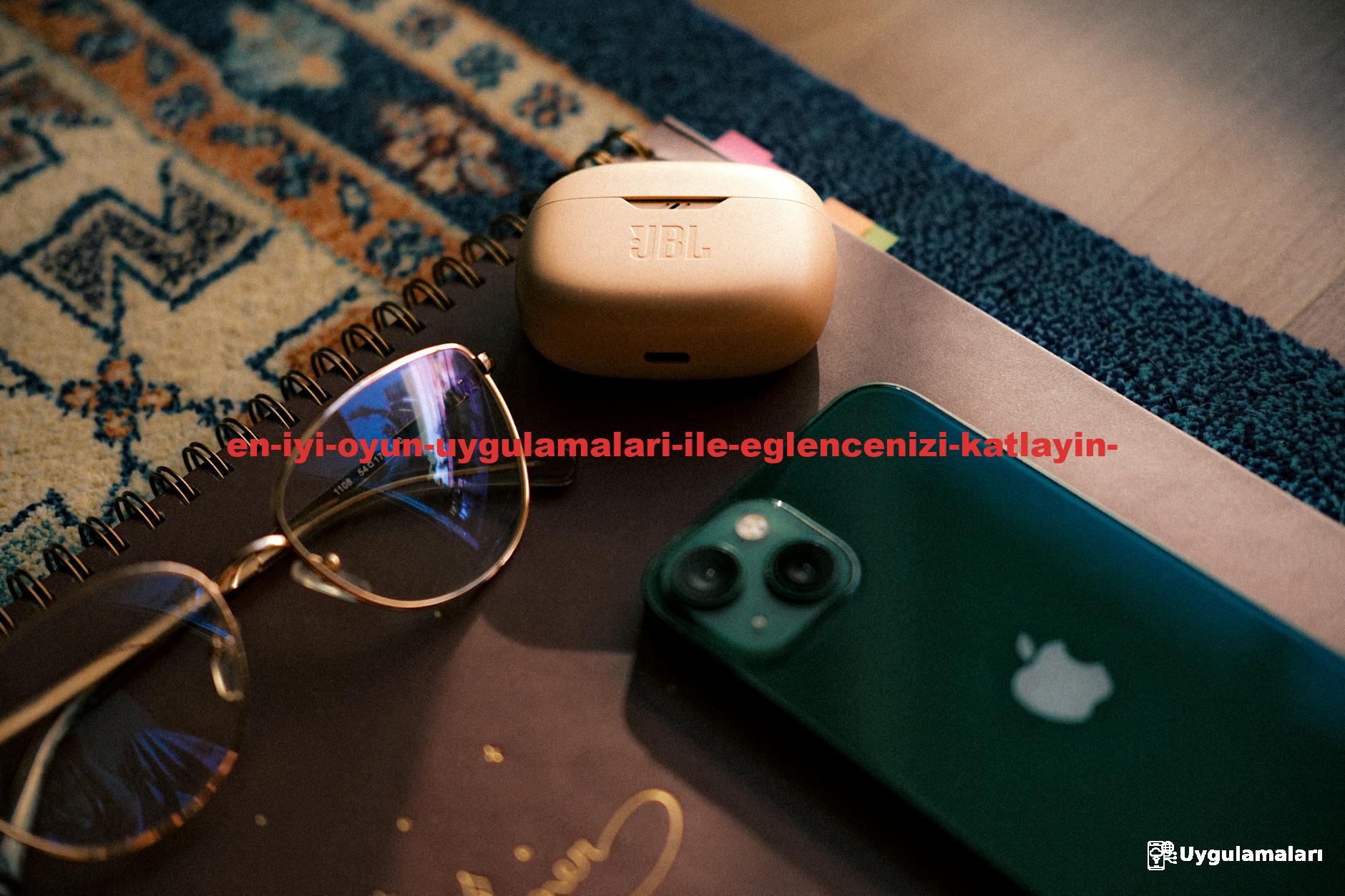 Flat lay of eyewear, smartphone, earbuds, and a notebook on a patterned rug.