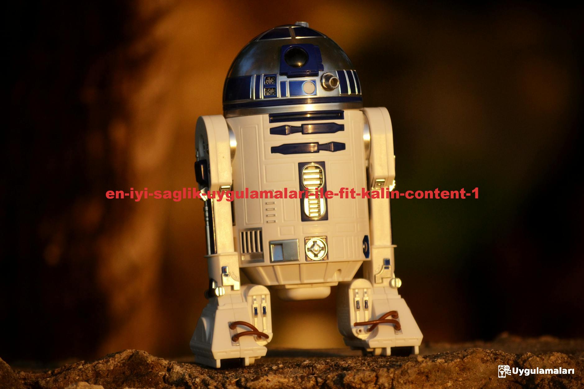 Close-up of a futuristic robot toy outdoors, showcasing its metallic and plastic components.